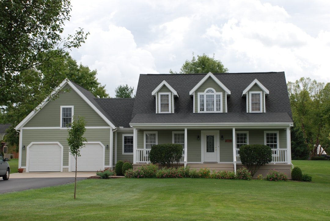 A two-story family home with a front porch and an attached garage